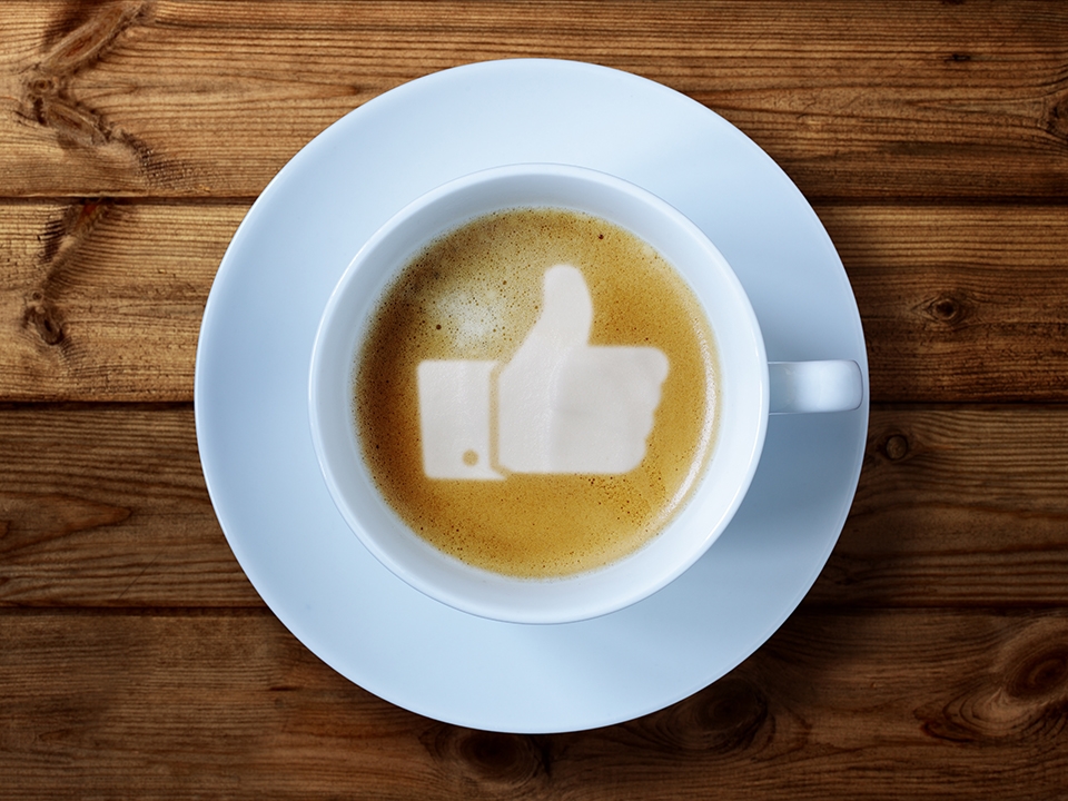 thumbs up in coffee foam