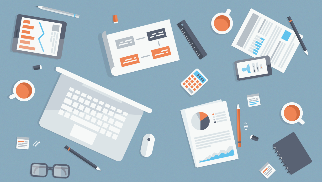 desk with papers and laptop